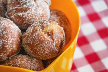 Freshly baked donuts in a bowl