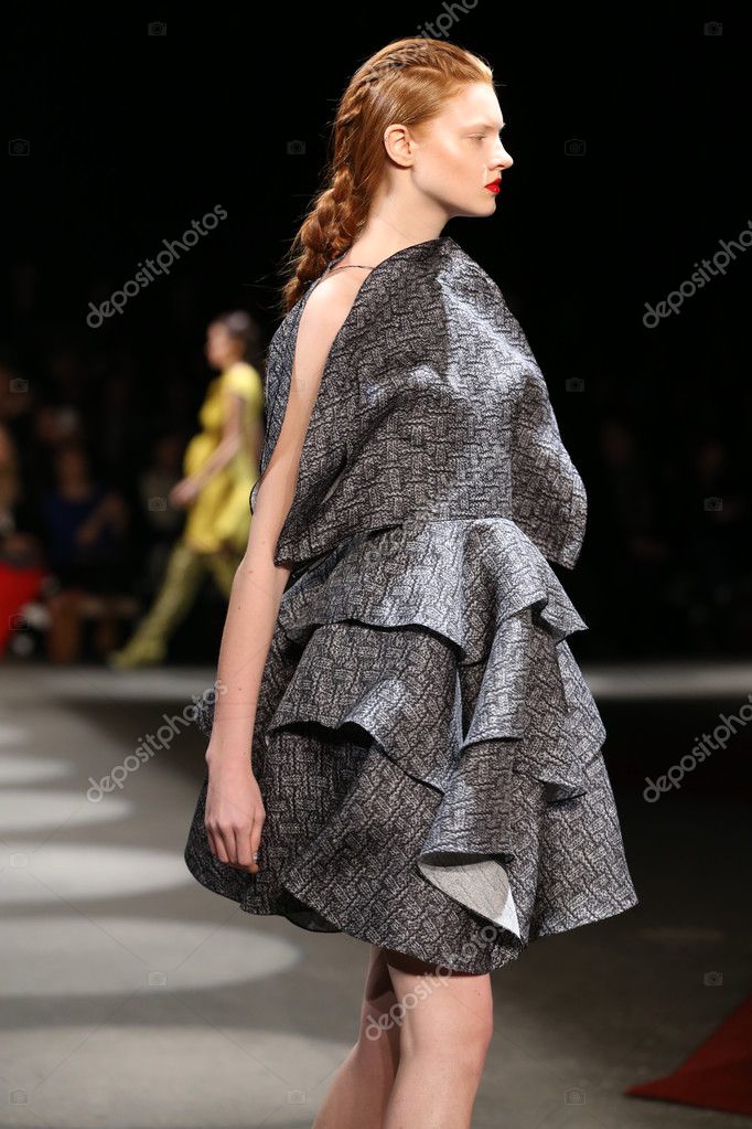 new york, ny - february 13: a model walks the runway wearing