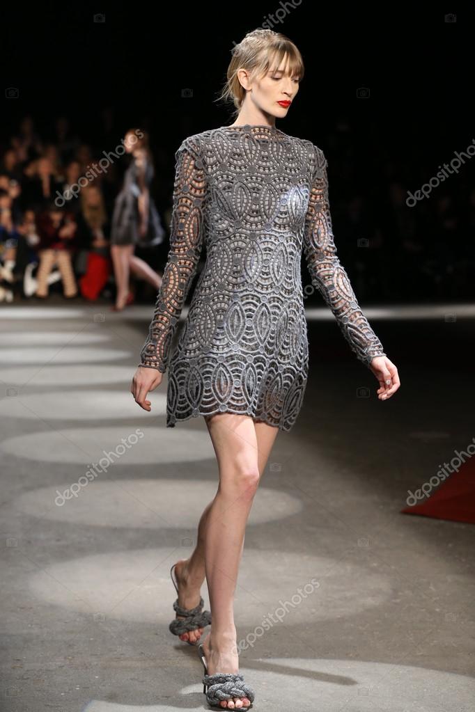 new york, ny - february 13: a model walks the runway wearing