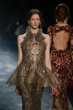 model walks the runway wearing Marchesa Fall 2016