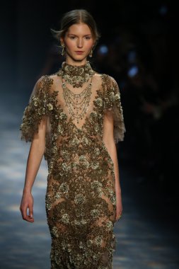 model walks the runway wearing Marchesa Fall 2016