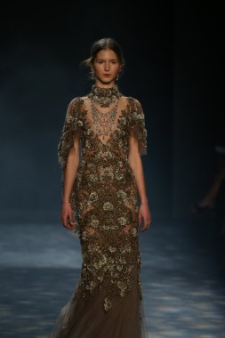 model walks the runway wearing Marchesa Fall 2016