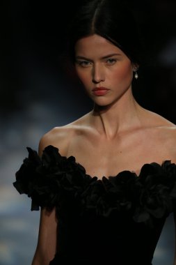 model walks the runway wearing Marchesa Fall 2016