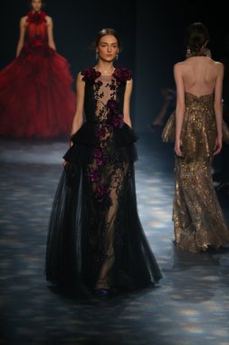 model walks the runway wearing Marchesa Fall 2016