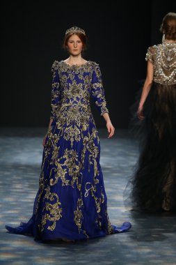 model walks the runway wearing Marchesa Fall 2016