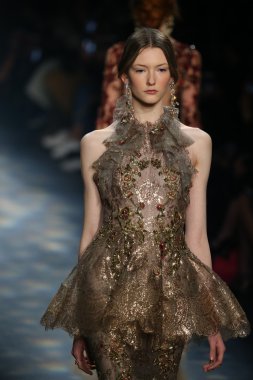 model walks the runway wearing Marchesa Fall 2016