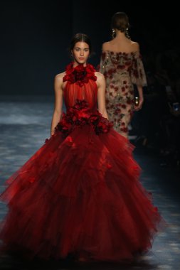 model walks the runway wearing Marchesa Fall 2016
