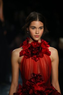 model walks the runway wearing Marchesa Fall 2016