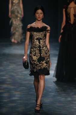 model walks the runway wearing Marchesa Fall 2016