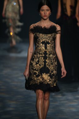 model walks the runway wearing Marchesa Fall 2016