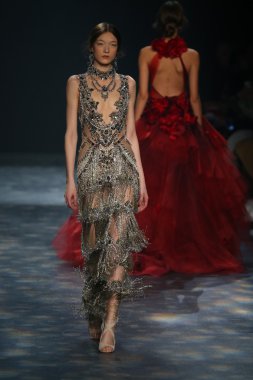 model walks the runway wearing Marchesa Fall 2016