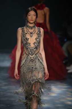model walks the runway wearing Marchesa Fall 2016