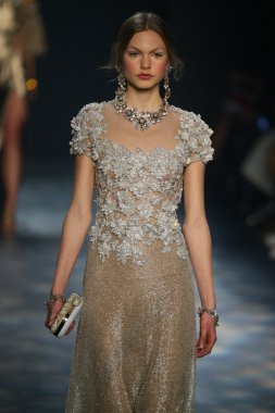 model walks the runway wearing Marchesa Fall 2016