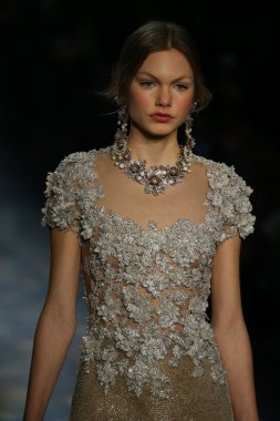 model walks the runway wearing Marchesa Fall 2016