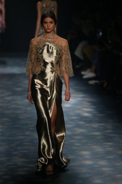 model walks the runway wearing Marchesa Fall 2016