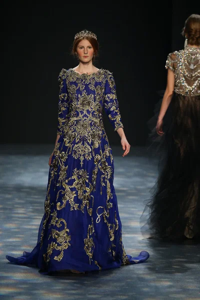 model walks the runway wearing Marchesa Fall 2016