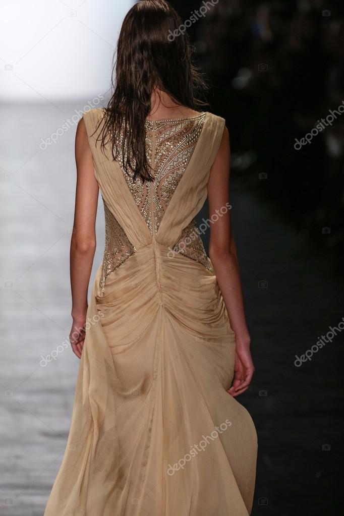 new york, ny - february 12: model walks the runway wearing