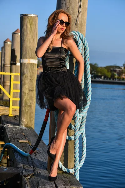 Gorgeous fashion model in black dress — Stock Photo, Image