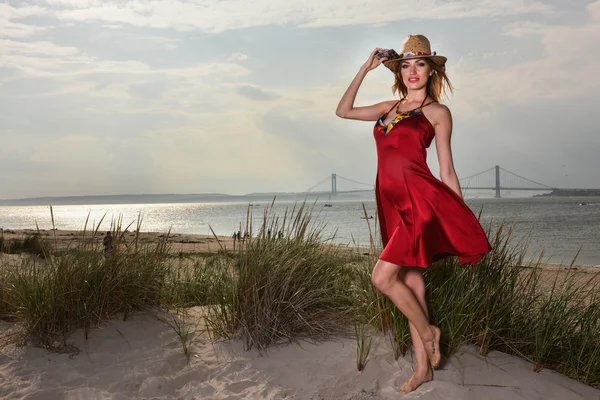 Fashionable young woman in red dress — Stock Photo, Image