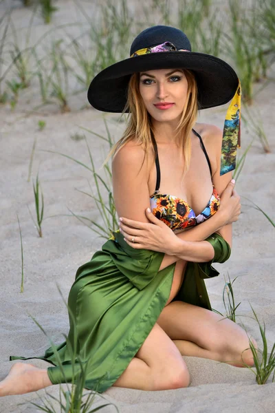 Young beautiful sexy blonde bikini model posing on the beach — Stock Fotó