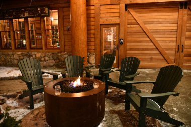 Stowe Mountain Ski Resort in Vermont, fire rink and chairs at Spruce peak villlage at night,  hi-resolution image clipart