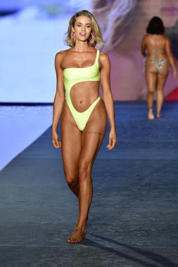 MIAMI, FLORIDA - JULY 10: Allie Ayers  walks the runway during the 2021 Sports Illustrated Swimsuit Runway Show during Paraiso Miami Beach at Mondrian South Beach on July 10, 2021 in Miami, Florida.