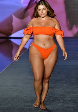 MIAMI, FLORIDA - JULY 10: Ella Halikas  walks the runway during the 2021 Sports Illustrated Swimsuit Runway Show during Paraiso Miami Beach at Mondrian South Beach on July 10, 2021 in Miami, Florida.