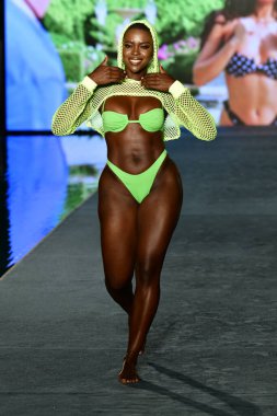 MIAMI, FLORIDA - JULY 10: Saje Nicole walks the runway during the 2021 Sports Illustrated Swimsuit Runway Show during Paraiso Miami Beach at Mondrian South Beach on July 10, 2021 in Miami, Florida.