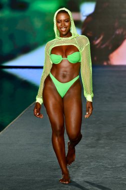 MIAMI, FLORIDA - JULY 10: Saje Nicole walks the runway during the 2021 Sports Illustrated Swimsuit Runway Show during Paraiso Miami Beach at Mondrian South Beach on July 10, 2021 in Miami, Florida.