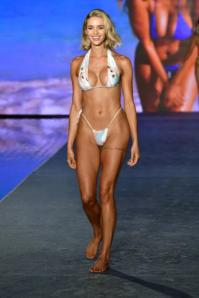 MIAMI, FLORIDA - JULY 10: Allie Ayers  walks the runway during the 2021 Sports Illustrated Swimsuit Runway Show during Paraiso Miami Beach at Mondrian South Beach on July 10, 2021 in Miami, Florida.