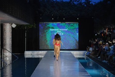 MIAMI BEACH, FLORIDA - JULY 08: Models walk the runway finale  for Supermodel Swimwear Show during Miami Swim Week The Shows powered by DCSW on July 08, 2021 in Miami Beach, Florida