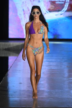 MIAMI BEACH, FLORIDA - JULY 08: A model walks the runway  for Tamarindo Show during Miami Swim Week The Shows powered by DCSW on July 08, 2021 in Miami Beach, Florida