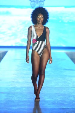 MIAMI BEACH, FLORIDA - JULY 08: A model walks the runway for Olga Niknoza Show during Miami Swim Week The Shows powered by DCSW on July 08, 2021 in Miami Beach, Florida