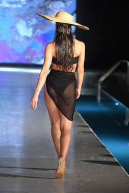 MIAMI BEACH, FLORIDA - JULY 08: A model walks the runway for Fortune Swim Club Show during Miami Swim Week The Shows powered by DCSW on July 08, 2021 in Miami Beach, Florida