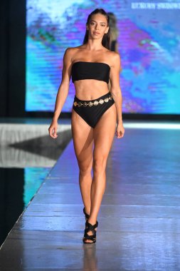 MIAMI BEACH, FLORIDA - JULY 08: A model walks the runway for Fortune Swim Club Show during Miami Swim Week The Shows powered by DCSW on July 08, 2021 in Miami Beach, Florida
