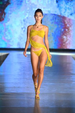 MIAMI BEACH, FLORIDA - JULY 08: A model walks the runway for Eight Swim Show during Miami Swim Week The Shows powered by DCSW on July 08, 2021 in Miami Beach, Florida