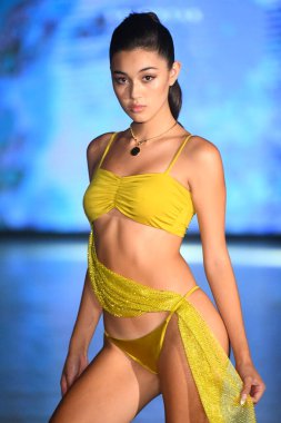 MIAMI BEACH, FLORIDA - JULY 08: A model walks the runway for Eight Swim Show during Miami Swim Week The Shows powered by DCSW on July 08, 2021 in Miami Beach, Florida