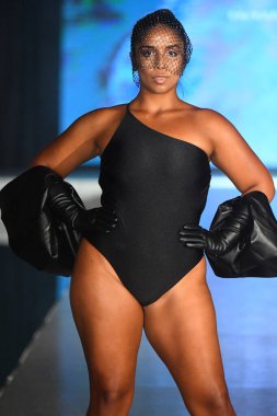 MIAMI BEACH, FLORIDA - JULY 08: A model walks the runway for Eight Swim Show during Miami Swim Week The Shows powered by DCSW on July 08, 2021 in Miami Beach, Florida