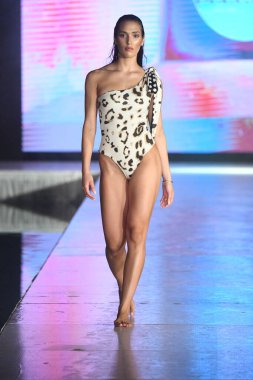 MIAMI BEACH, FLORIDA - JULY 08: A model walks the runway for DELYX LTD Show during Miami Swim Week The Shows powered by DCSW on July 08, 2021 in Miami Beach, Florida