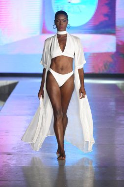 MIAMI BEACH, FLORIDA - JULY 08: A model walks the runway for DELYX LTD Show during Miami Swim Week The Shows powered by DCSW on July 08, 2021 in Miami Beach, Florida