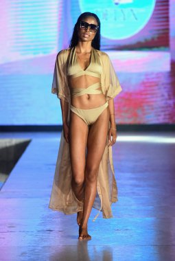 MIAMI BEACH, FLORIDA - JULY 08: A model walks the runway for DELYX LTD Show during Miami Swim Week The Shows powered by DCSW on July 08, 2021 in Miami Beach, Florida