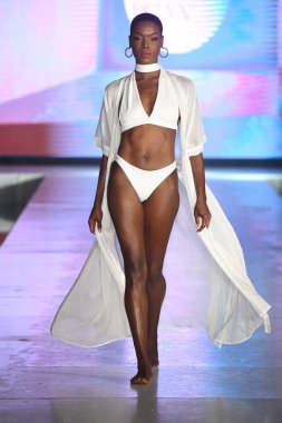 MIAMI BEACH, FLORIDA - JULY 08: A model walks the runway for DELYX LTD Show during Miami Swim Week The Shows powered by DCSW on July 08, 2021 in Miami Beach, Florida