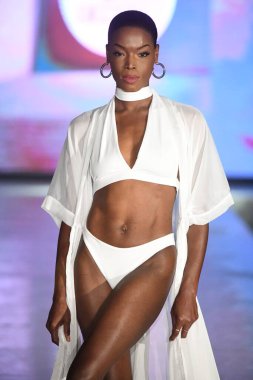 MIAMI BEACH, FLORIDA - JULY 08: A model walks the runway for DELYX LTD Show during Miami Swim Week The Shows powered by DCSW on July 08, 2021 in Miami Beach, Florida