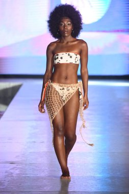 MIAMI BEACH, FLORIDA - JULY 08: A model walks the runway for DELYX LTD Show during Miami Swim Week The Shows powered by DCSW on July 08, 2021 in Miami Beach, Florida