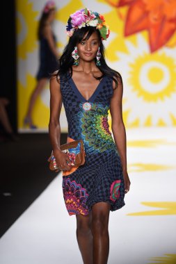 Model walks the runway at Desigual during Mercedes-Benz Fashion Week Spring 2015 clipart