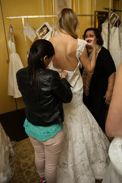 Model getting ready backstage wearing Oleg Cassini Fall 2015 Bridal collection — Stock Photo, Image