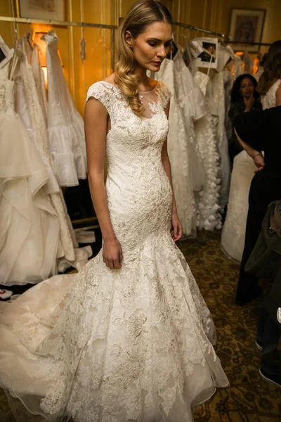 Model getting ready backstage wearing Oleg Cassini Fall 2015 Bridal collection — Stock Photo, Image