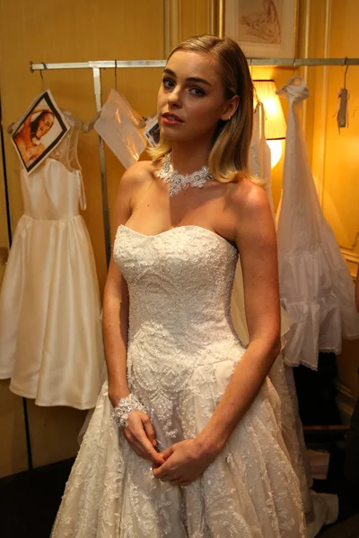 Model getting ready backstage wearing Oleg Cassini Fall 2015 Bridal collection — Stock Photo, Image