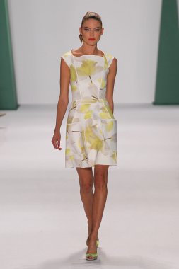 Model Martha Hunt walk the runway at the Carolina Herrera fashion show