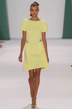 Model Kate Grigorieva walk the runway at the Carolina Herrera fashion show